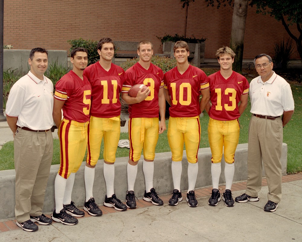 Sark (far left) and Norm Chow (far right) as coworkers (Photo from usctrojans.com/blog)